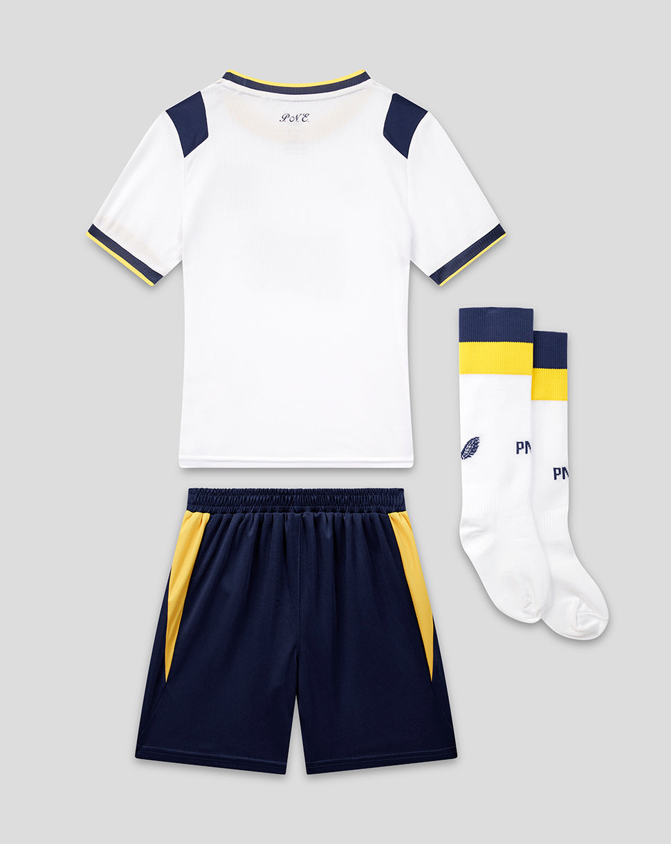 Children's sports outfit with white jersey, navy shorts, and socks on a light gray background