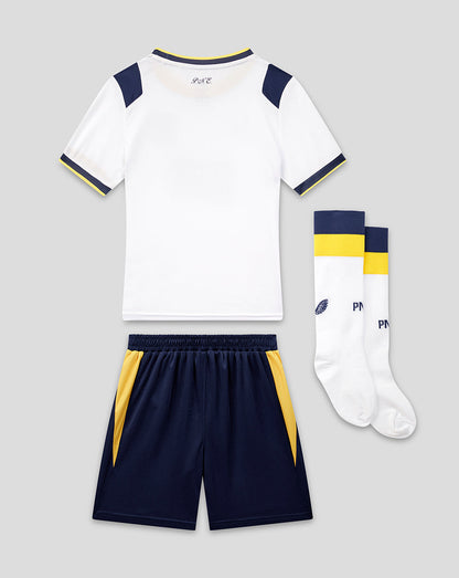 Children's sports outfit with white jersey, navy shorts, and socks on a light gray background