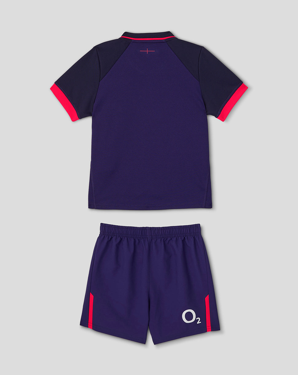 Navy sports outfit with red accents on a light gray background