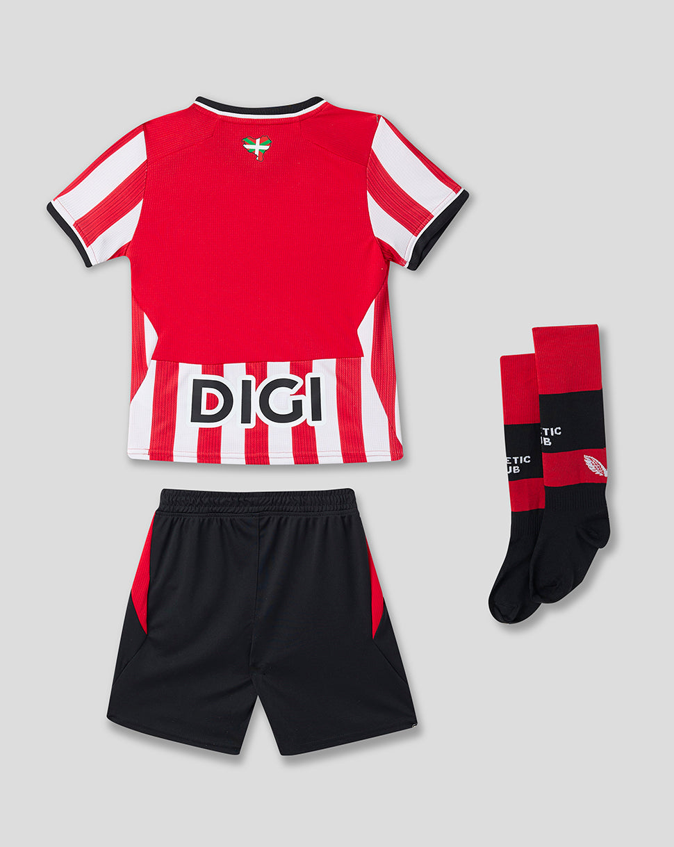 Athletic Club Junior home kit red shirt with white and red striped lower panel, black shorts, and socks.