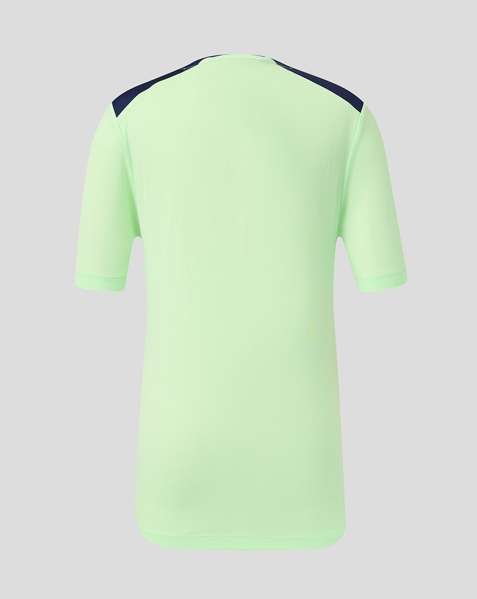 Back view of junior neon green training jersey with navy shoulder panels