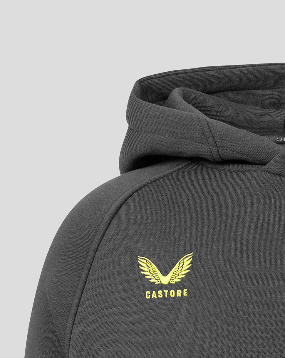 Close-up of a dark gray hooded sweatshirt with a yellow embroidered winged logo and the word 'CASTORE' on the chest, shown against a light gray background.
