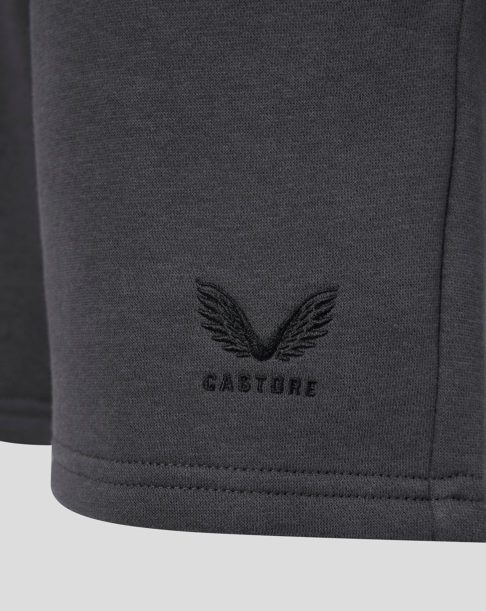 Close-up of the Castore wing logo and CASTORE text embroidered on the shorts.