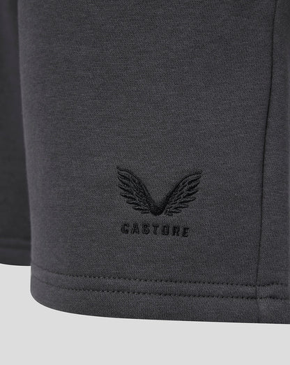 Close-up of the Castore wing logo and CASTORE text embroidered on the shorts.