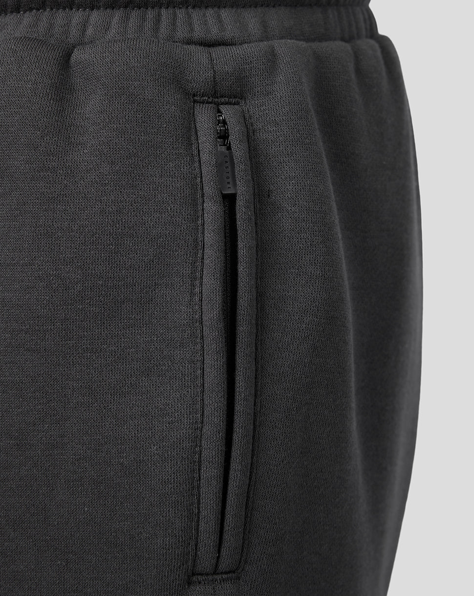 Close-up of black FC Utrecht Travel Fleece Shorts showing a side zip pocket and an elasticated waistband.