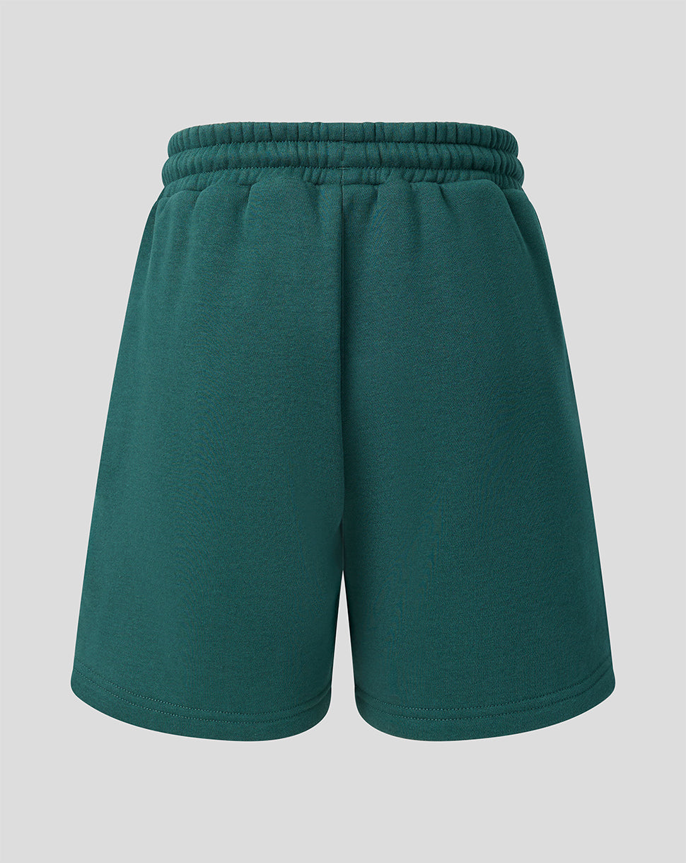 Back view of green Feyenoord travel shorts with an elastic drawstring waistband.