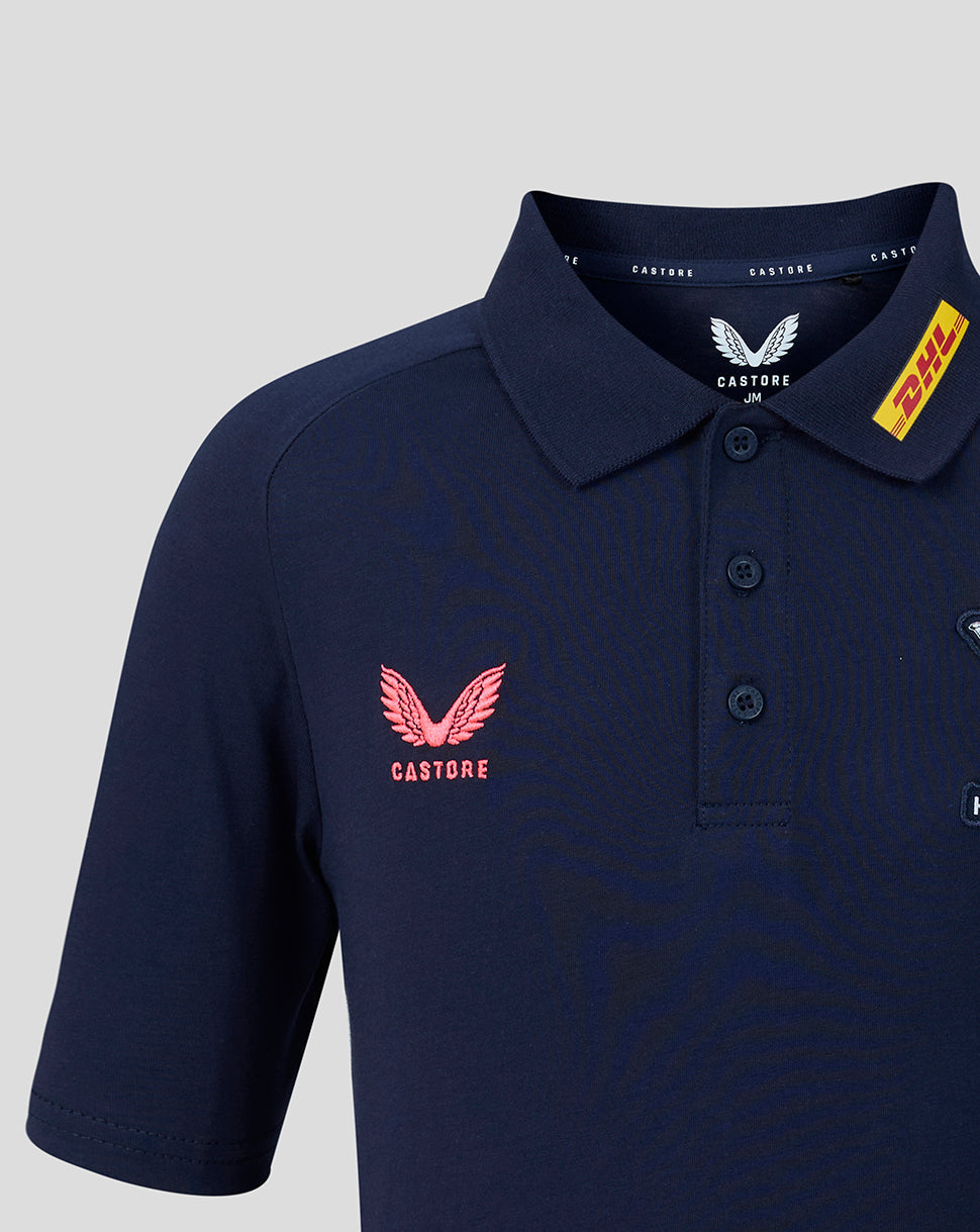 Navy blue polo shirt with pink logo and 'Castore' branding on a light gray background