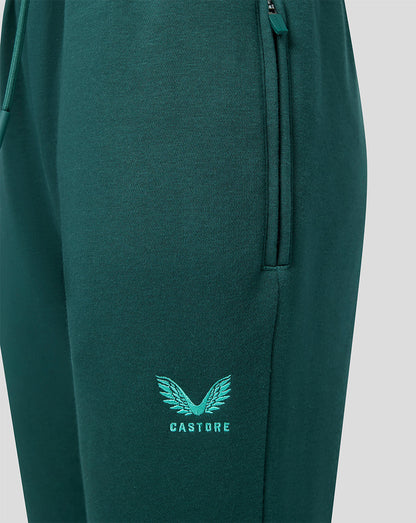 Logotipo Castore y emblema en la pierna de los joggers verdes para junior