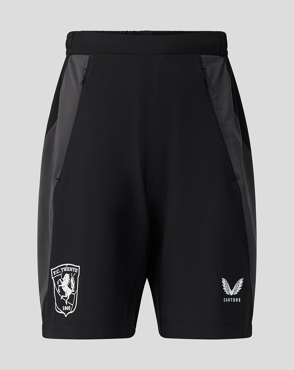 Black FC Twente junior training shorts with gray side panels, FC Twente crest on the left leg and Castore logo on the right.