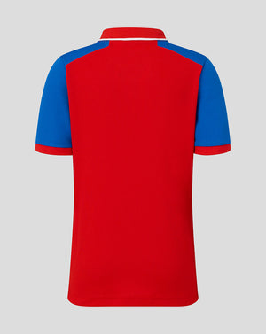 Red polo shirt with blue sleeves on a gray background