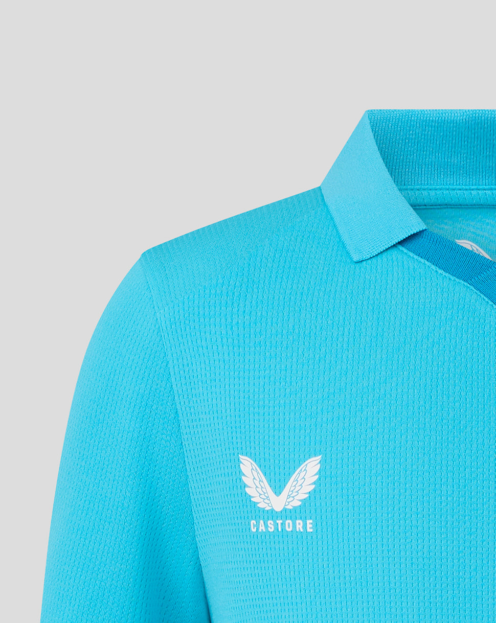 Blue polo shirt with a visible brand logo on a light gray background