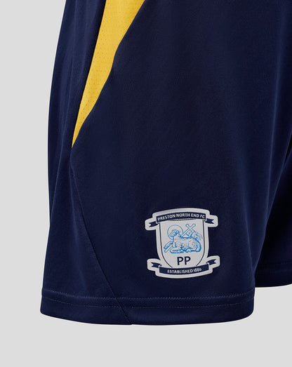 Navy sports shorts with yellow stripe and club logo on a light gray background