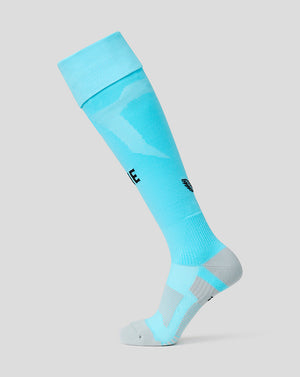 Light blue knee-high sock with brand logos on a gray background