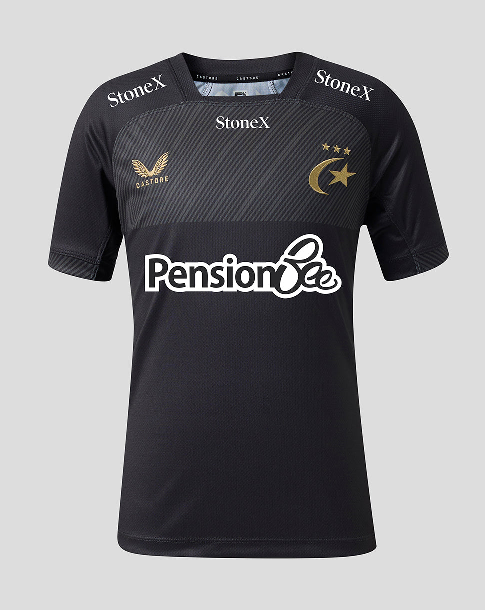 A black short-sleeve sports jersey with a textured dark gray chest panel, featuring the 'Pension Bee' sponsor logo in white across the center, 'StoneX' branding on the shoulders, and a gold winged bird crest with 'Castore' on the right chest, alongside a gold crescent and stars emblem on the left chest, set against a solid light gray background.