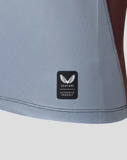 Gray athletic shorts with a Castore logo on a light gray background
