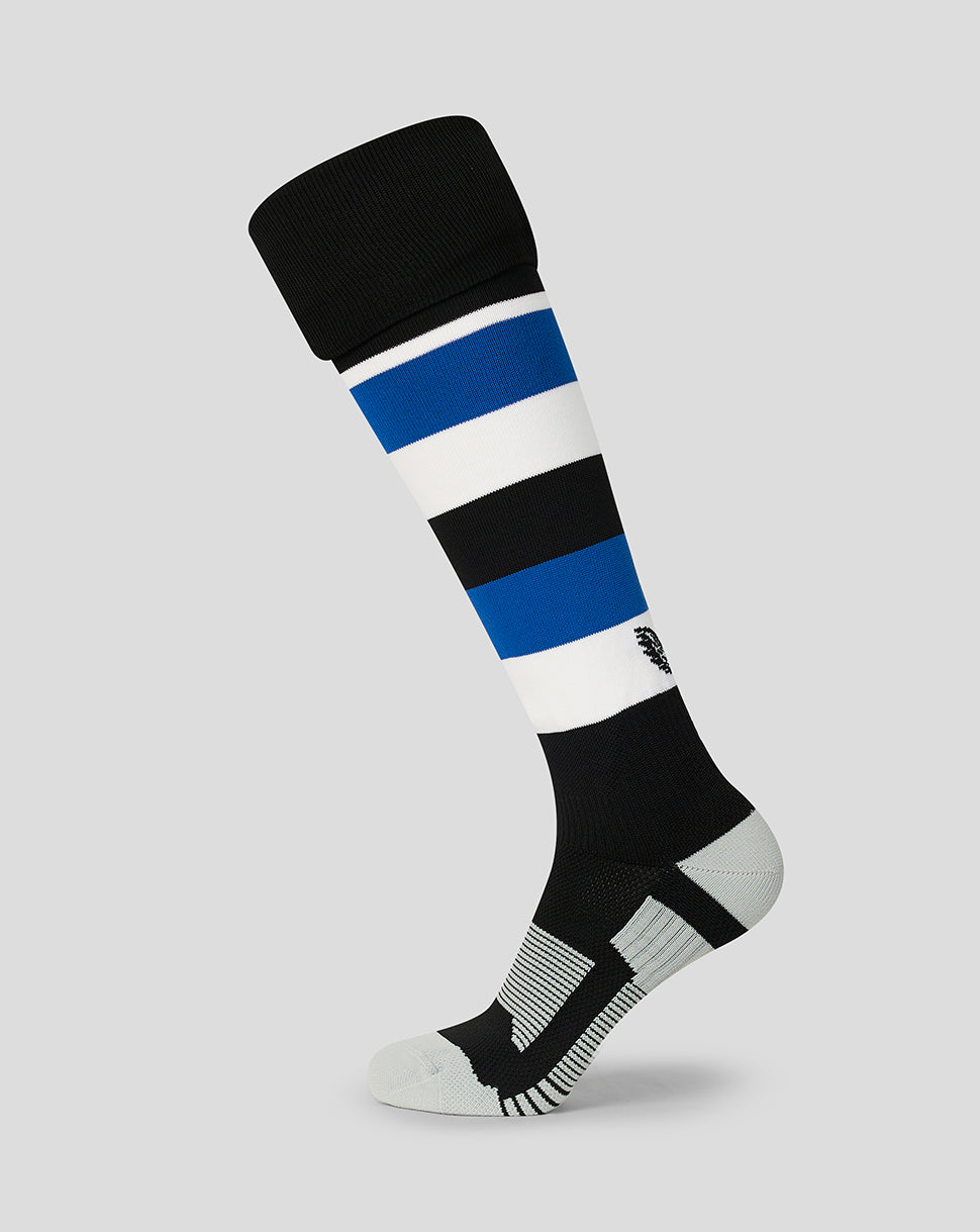 A single knee-high athletic sock shown on a light gray background. The sock features horizontal stripes of black, white, and blue, with a black cuff, a black and white striped heel, and a white toe.