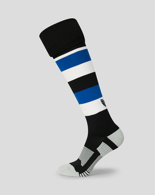 A single knee-high athletic sock shown on a light gray background. The sock features horizontal stripes of black, white, and blue, with a black cuff, a black and white striped heel, and a white toe.