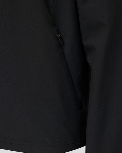 Close-up of a black Athletic Club jacket showing a side seam zipper