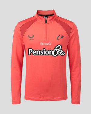 A coral pink long-sleeve athletic quarter-zip pullover with dark red shoulder panels and a white 'Pension Bee' sponsor logo across the chest, shown on a solid gray background.