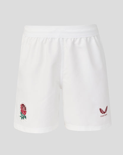 White shorts with embroidered rose and eagle design on a light gray background