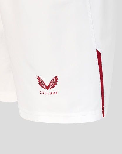 White shorts with red accents and 'Castore' logo on a light gray background