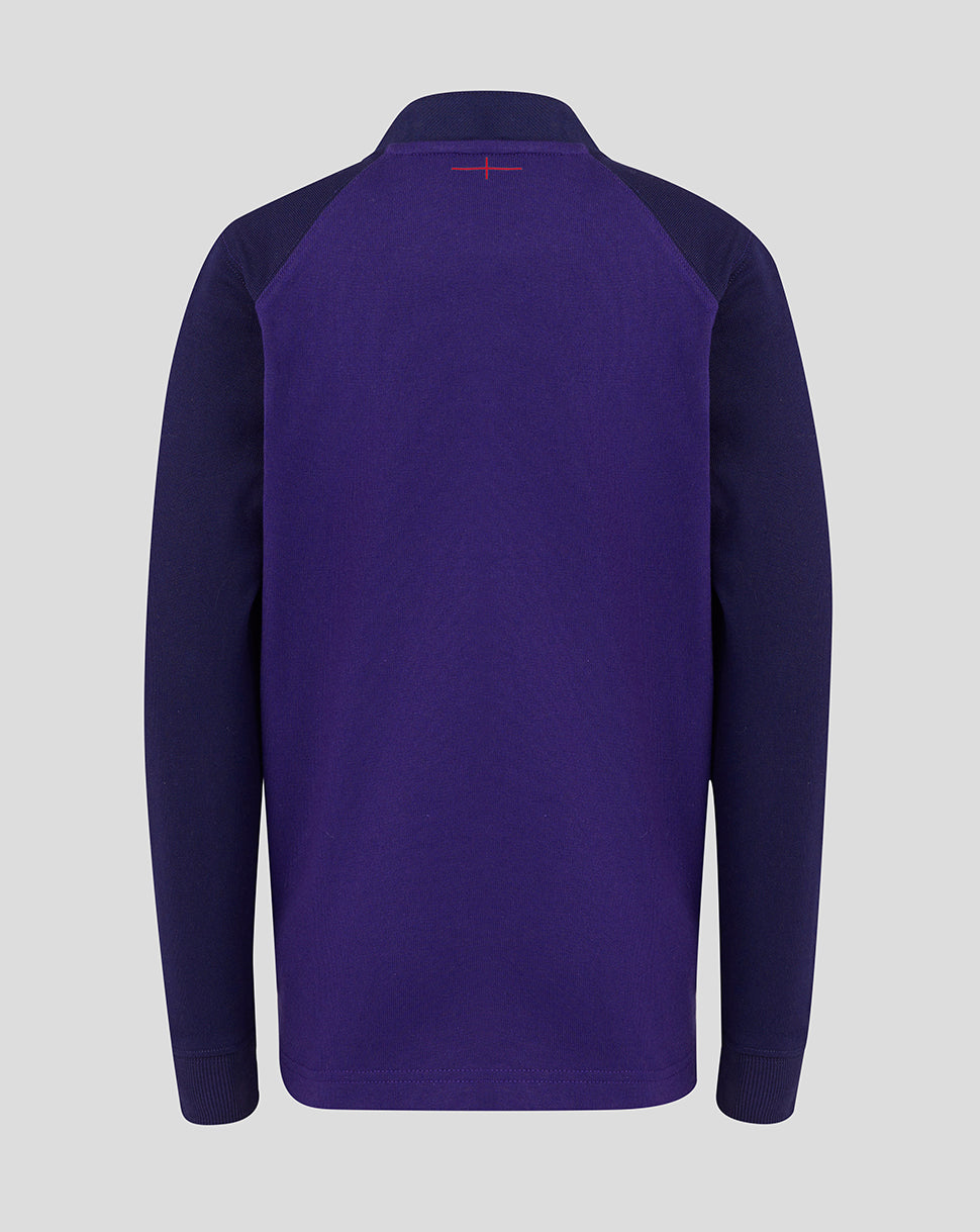 Purple long-sleeve shirt with a small red logo on the chest against a light gray background