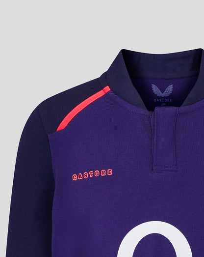 Navy rugby jersey with red accents and 'CASTORE' branding on a light gray background