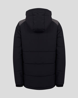 A black hooded puffer jacket shown from the back, featuring horizontal quilting and contrasting dark gray shoulder panels, set against a solid light gray background.