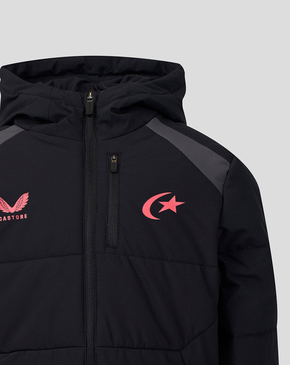 A close-up of a black hooded puffer jacket with a front zipper, featuring a pink winged logo on the left chest and a pink crescent and star logo on the right chest, set against a light gray background.