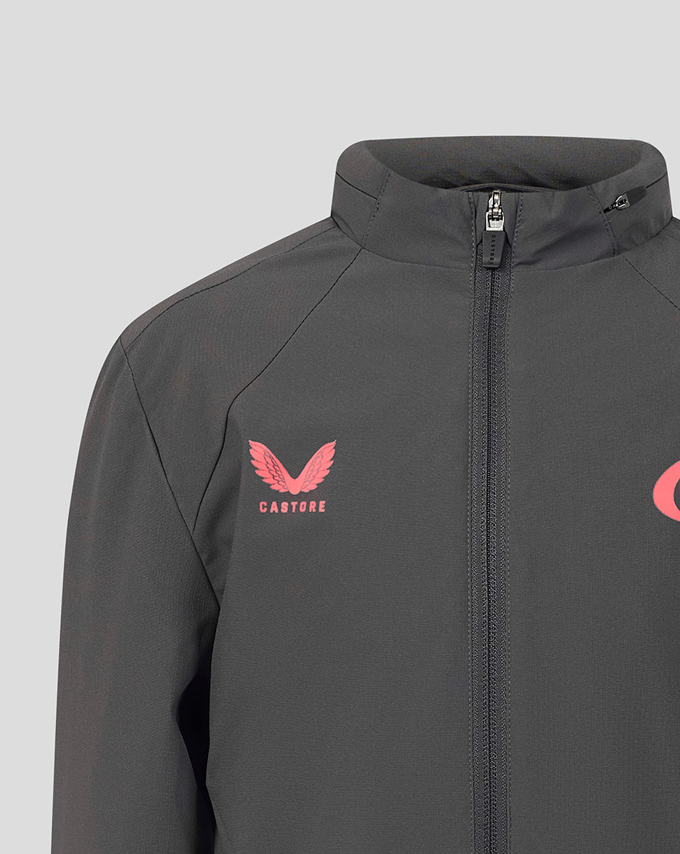A close-up of a dark gray athletic jacket featuring a pink winged logo with the word 'CASTORE' underneath on the left chest, set against a light gray background.