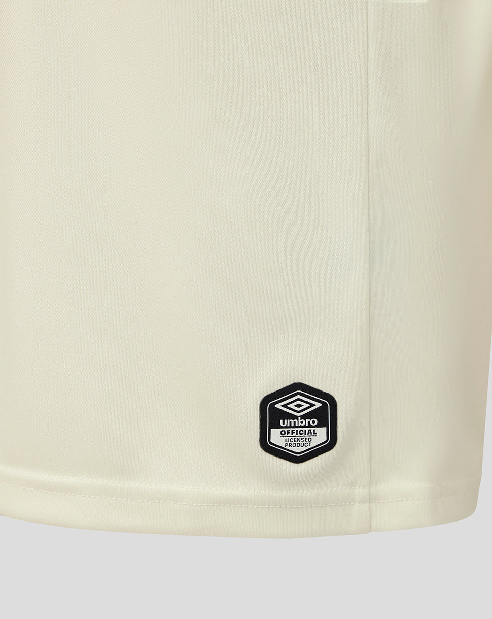 Beige shorts with a black Umbro logo on a white background