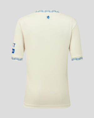 Beige sports jersey with blue accents on a light gray background