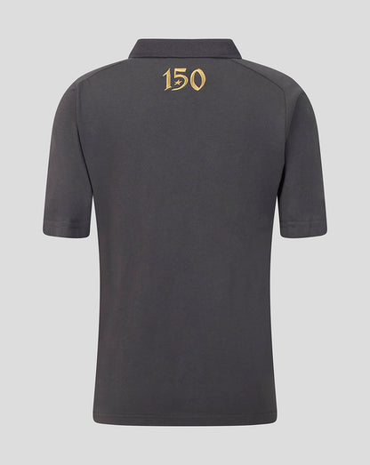 A dark gray short-sleeve polo shirt shown from the back, featuring a gold '150' graphic printed on the upper back, set against a solid light gray background.