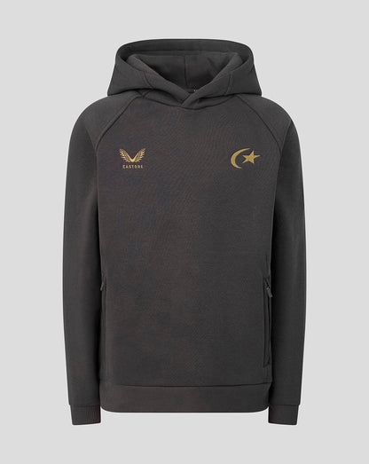 A dark gray pullover hoodie with gold embroidered logos on the chest, featuring a winged logo on the wearer's left side and a crescent moon and star logo on the right side, displayed against a solid light gray background.
