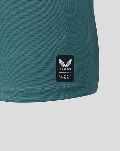 Close up of hem showing Castore authentic product patch on teal Everton shirt