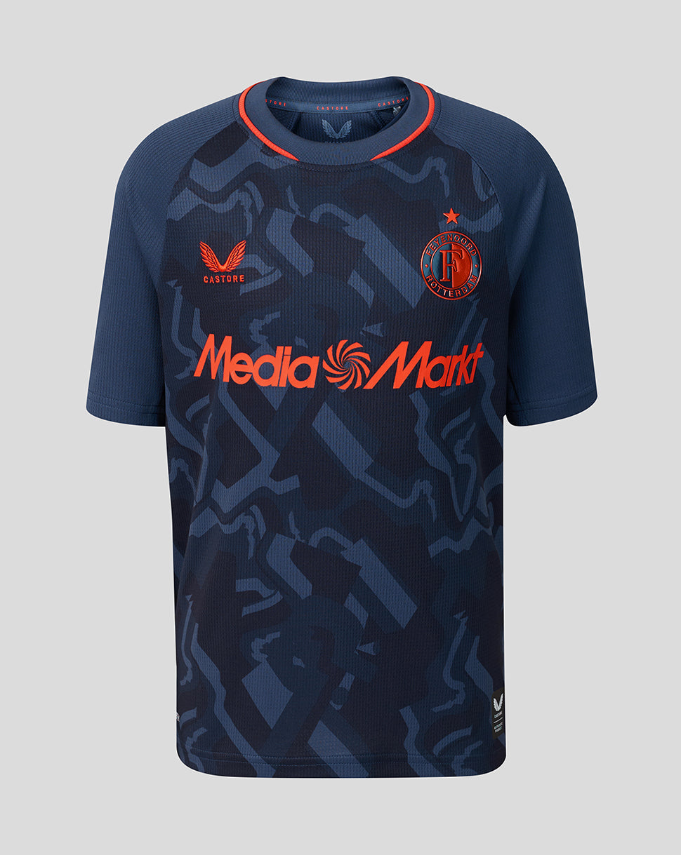 Front view of Feyenoord Junior Third Shirt with navy camouflage pattern, orange Media Markt sponsor, Castore logo and Feyenoord crest.
