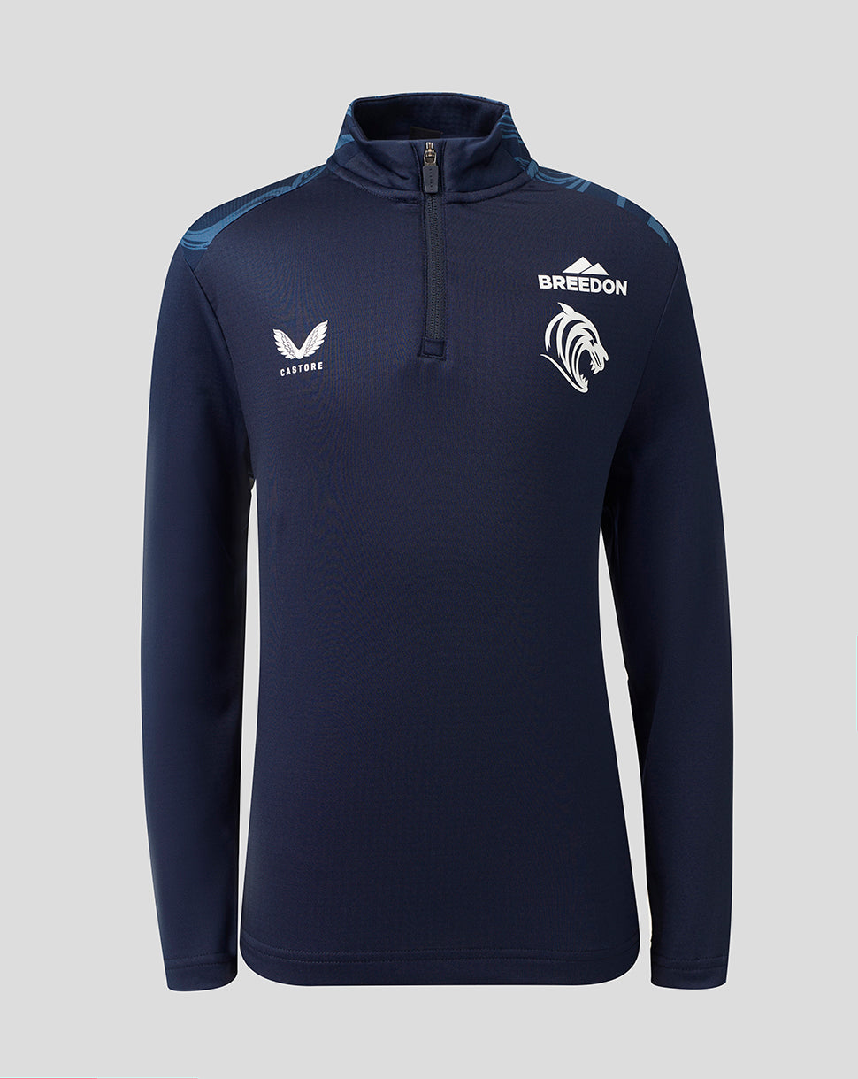 A navy blue long-sleeve athletic quarter-zip pullover with white printed logos on the chest, including 'BREEDON' and a winged emblem, shown against a solid gray background.