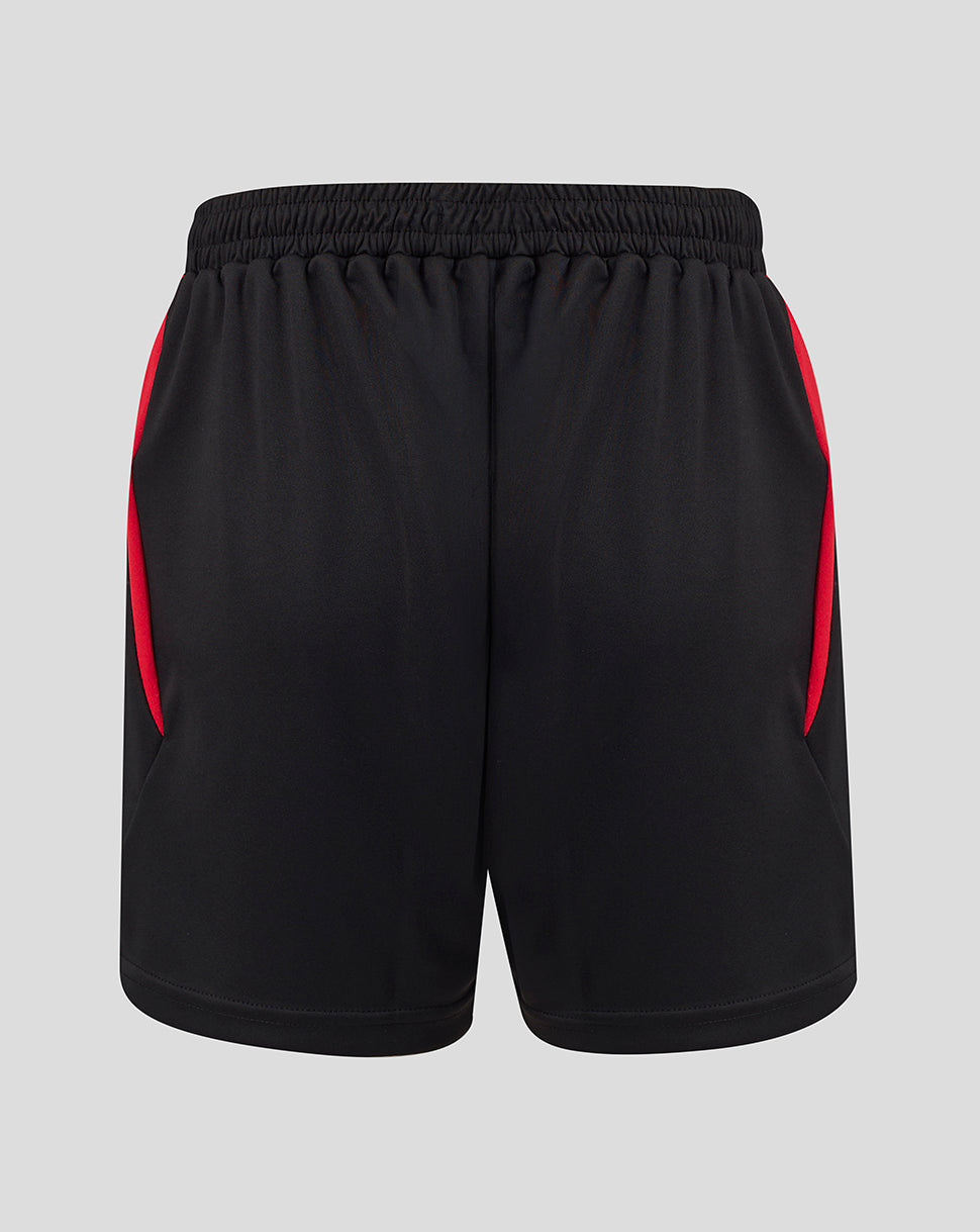 Side view of black FC Twente junior away shorts with red panels and a visible crest on the left leg.