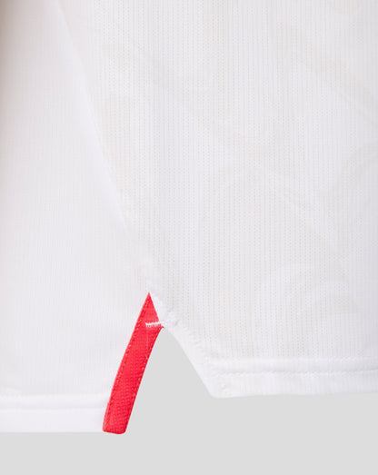 White FC Twente junior matchday shirt fabric close-up with a red diagonal stripe detail