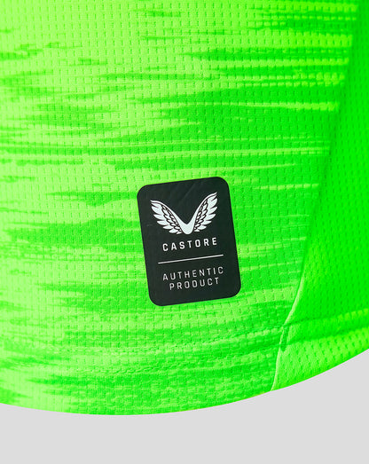 Neon green goalkeeper jersey fabric with Castore authentic product patch