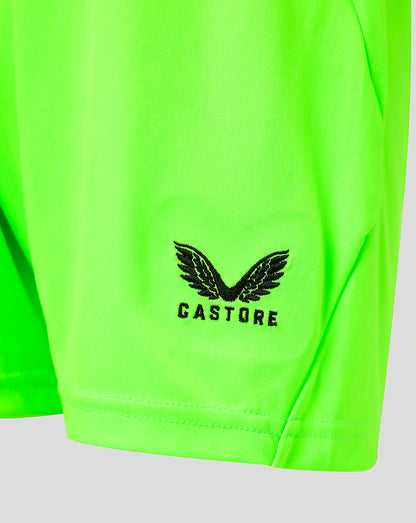Close-up of neon green fabric showing the Castore logo near the hem of Athletic Club goalkeeper shorts.