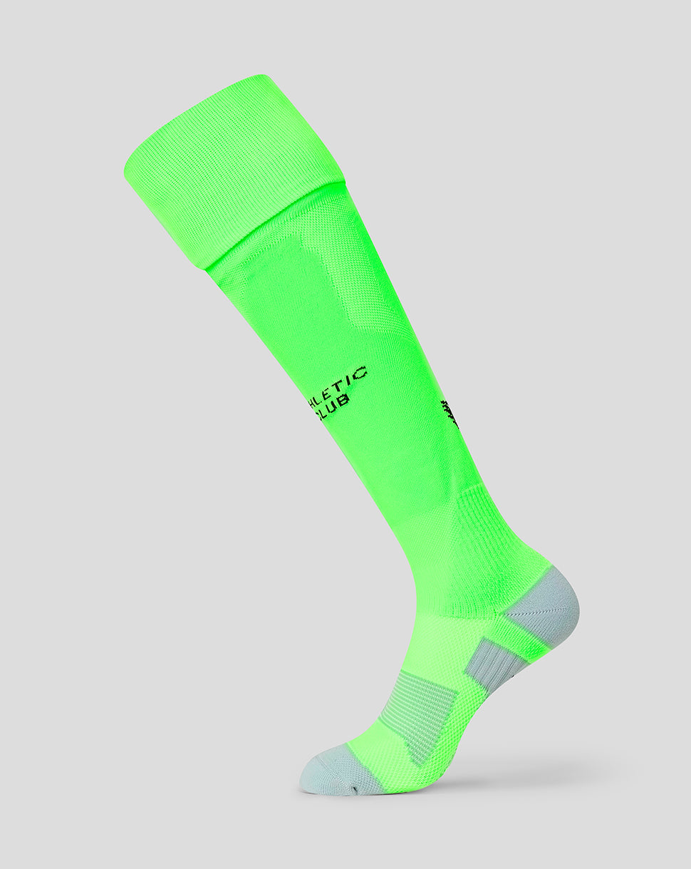Bright neon green away goalkeeper sock with black Athletic Club logo and gray heel and toe.