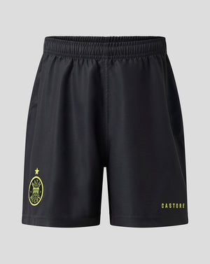 Black athletic shorts with a yellow Castore logo on the left leg and a yellow crest on the right leg, shown against a light gray background.