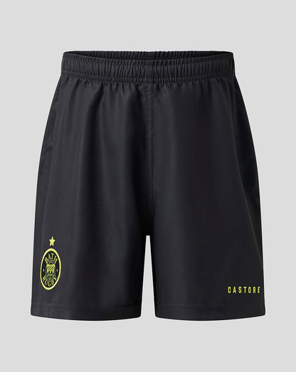 Black athletic shorts with a yellow Castore logo on the left leg and a yellow crest on the right leg, shown against a light gray background.