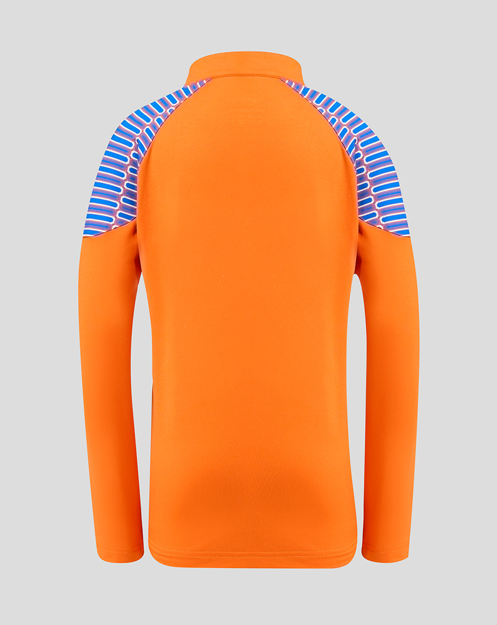 An orange long-sleeve athletic top shown from the back, featuring a blue and white striped pattern on the shoulders and upper back, set against a solid gray background.