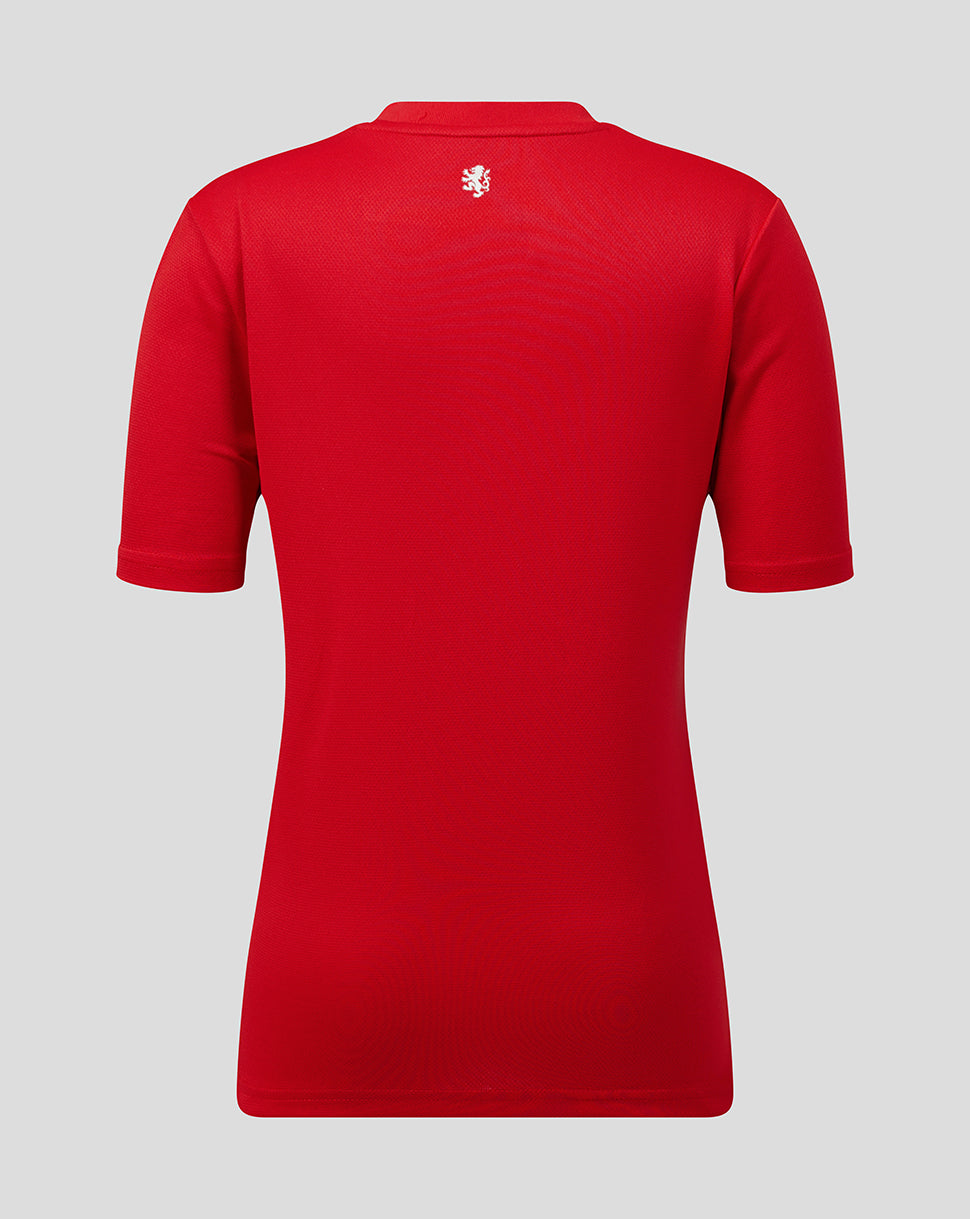 Red polo shirt with a logo on the back against a gray background