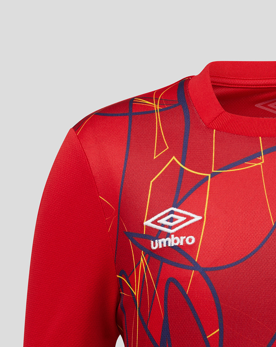 Red sports jersey with geometric patterns and Umbro logo on a gray background