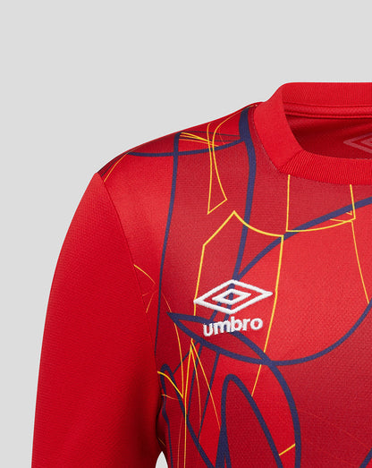 Red sports jersey with geometric patterns and Umbro logo on a gray background