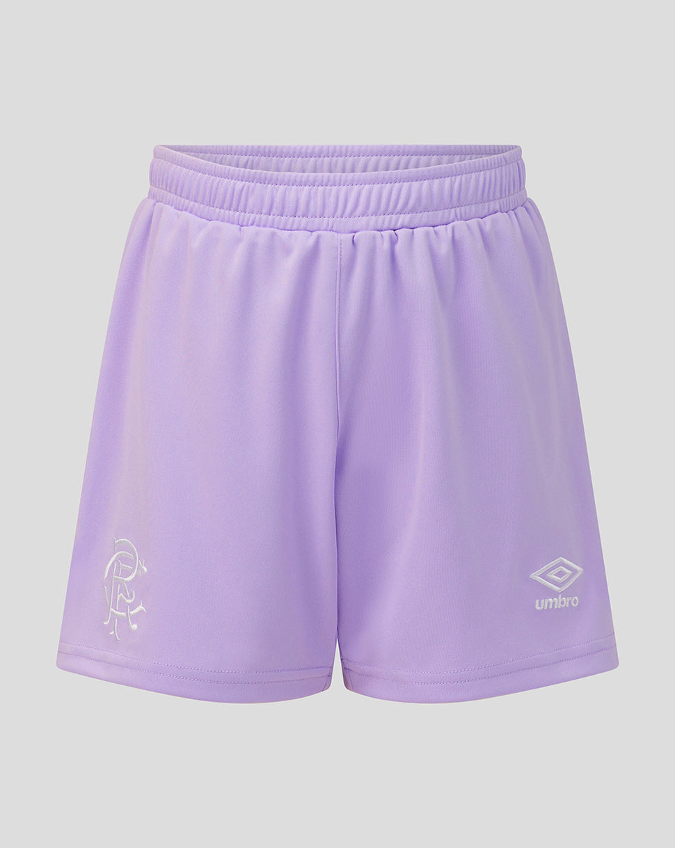 Light purple athletic shorts with an elastic waistband, featuring a white embroidered Umbro logo on the lower right leg and a white crest on the lower left leg, shown against a solid gray background.