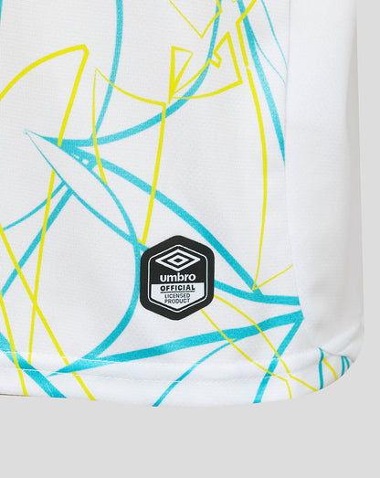 White sports jersey with blue and yellow abstract pattern and Umbro logo.